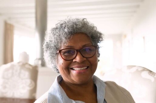 A happy senior feeling safe in her home.